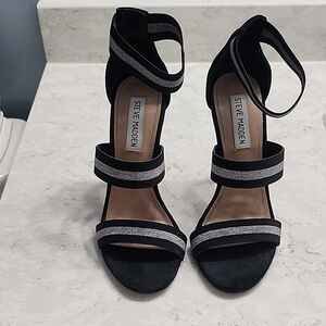 Size 6.5M Steve Madden Black Heeled Strappy Sandals with Silver Accents.